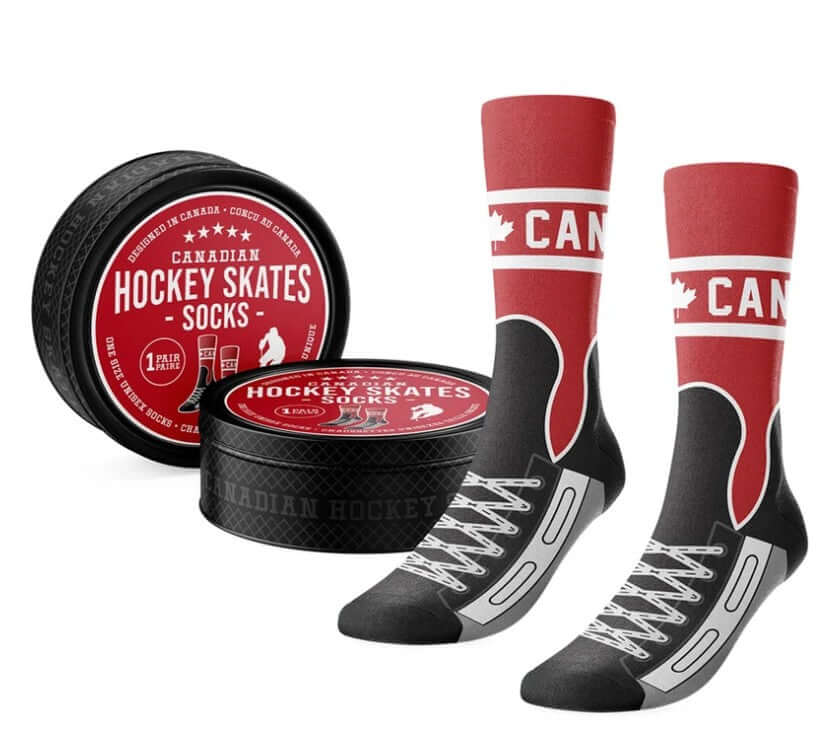 Pair of Canadian hockey skate socks with printed white laces and a red-and-white Canada design, beside a hockey puck-shaped tin