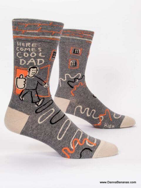 Blue Q Socks that say, “Here comes Cool Dad,” and show a super-slick man flashing a big thumbs-up as he heads out onto the scene.