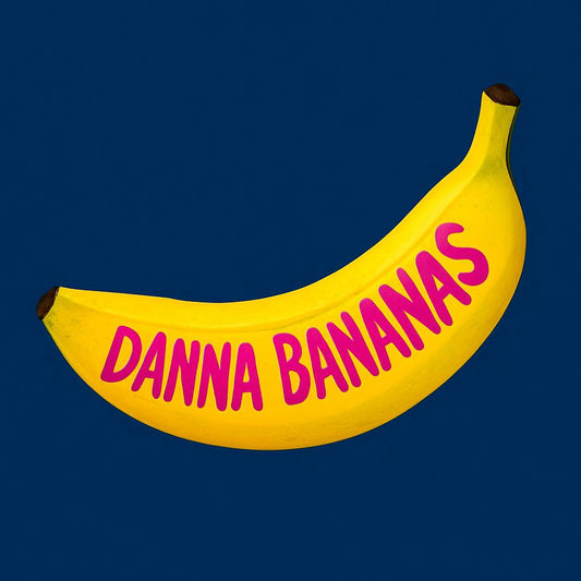 Symbolic illustration of a ripe yellow banana on a navy background with “Danna Bananas” hand-drawn in fluorescent pink, representing the fresh 2025 website launch.
