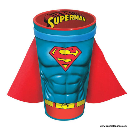Superman-themed pint glass with sculpted chest design and removable red cape, featuring the iconic 'S' shield logo on a blue background.