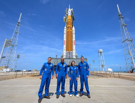 Artemis II astronauts standing in front of NASA SLS rocket before the 2026 moon mission