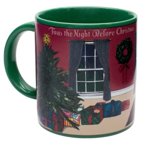 The "Twas the Night Before Christmas Heat-Changing Mug" by Danna Bananas is a delightful holiday gift that features a Christmas scene with a decorated tree, wrapped presents, and a wreath against a red wall. Pour in your drink to magically reveal the text "'Twas the Night Before Christmas.