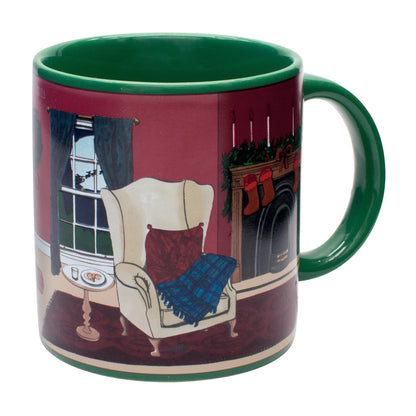 The "Twas the Night before Christmas Heat-Changing Mug" by Danna Bananas is a charming holiday coffee mug featuring a green interior and a cozy living room scene. It showcases an armchair, plaid blanket, window with curtains, fireplace with stockings, and a small side table—making it the perfect gift to capture the spirit of the season.