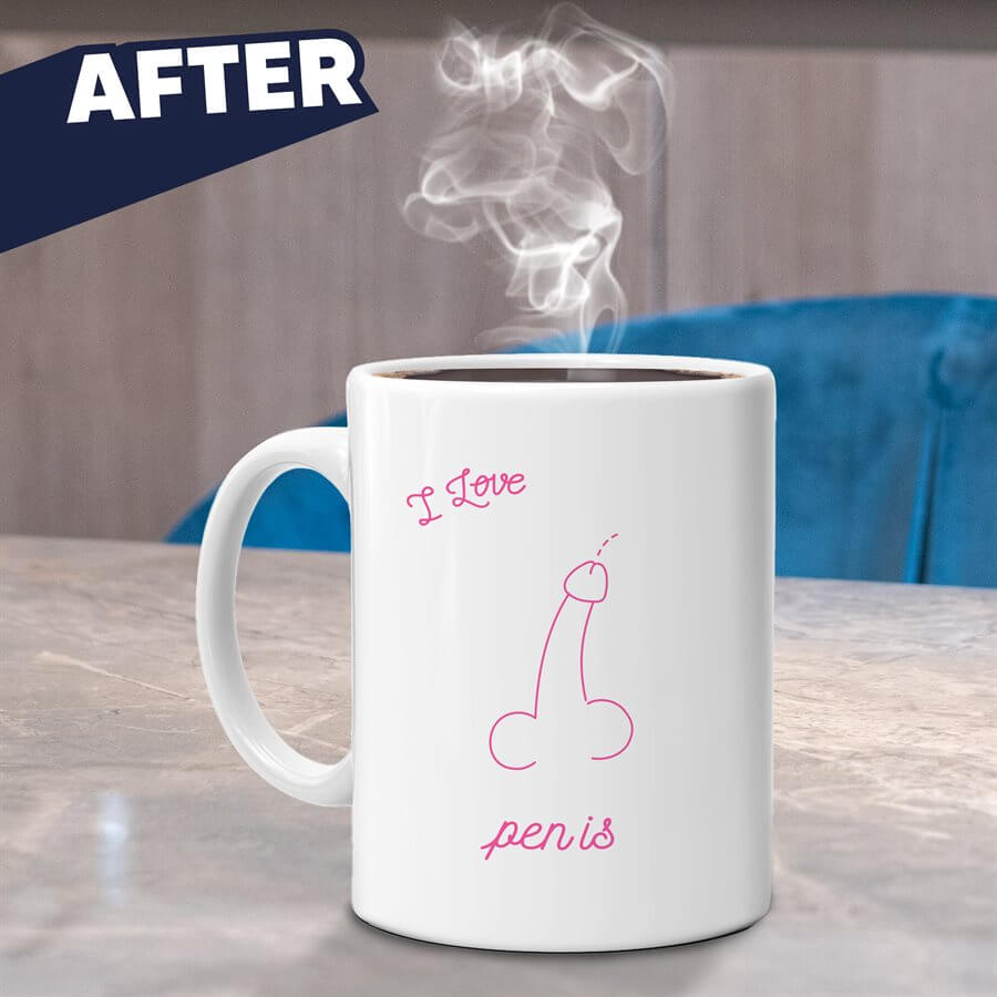 A white Jabco Pigpen Island Heat Changing Mug, featuring a playful outline and "I Love" with "pen is," sits steaming on a table—a quirky gift choice. A blue chair adds to the whimsical vibe in the background.