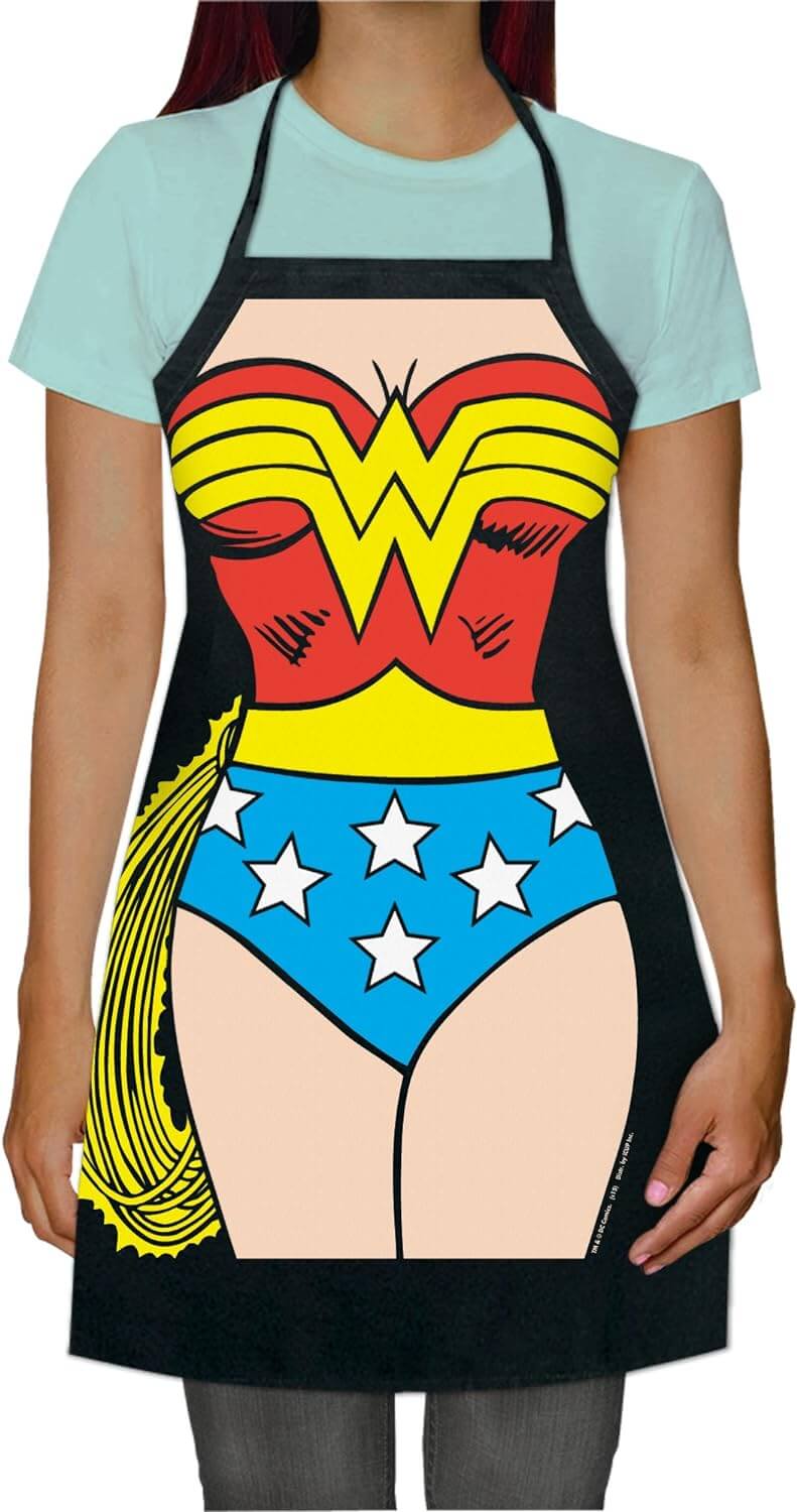 Woman wearing Wonder Woman apron featuring classic costume design with red, yellow, and blue colors and star accents, ready for culinary action.