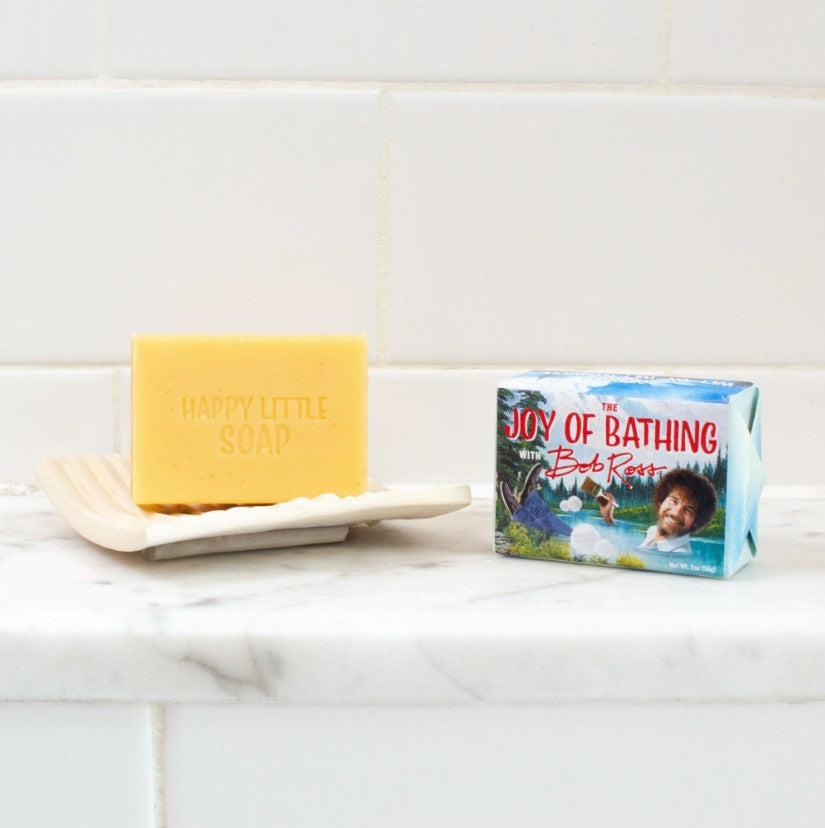The Joy of Bathing with Bob Ross bar of soap unwrapped. Soap stamped with Happy Little Soap.