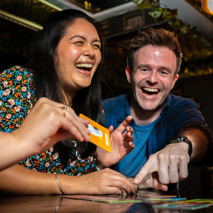 Friends playing Hands Off My Pecker party game