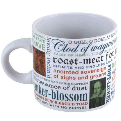 The Shakespeare Insults Mug by Danna Bananas showcases a white design embellished with vibrant, overlapping Shakespearian insults such as "clod of wayward marl" and "roast-meat for worms." The handle area features an illustration of Shakespeare, making it an ideal addition to any gift box.