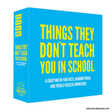 The Danna Bananas product, "Things They Don't Teach You In School Hygge Board Game," comes in a box adorned with bright blue and yellow text. It offers fun facts, random trivia questions, and seemingly useless knowledge, ideal for a Hygge board game night. This game is designed for ages 14 and up.