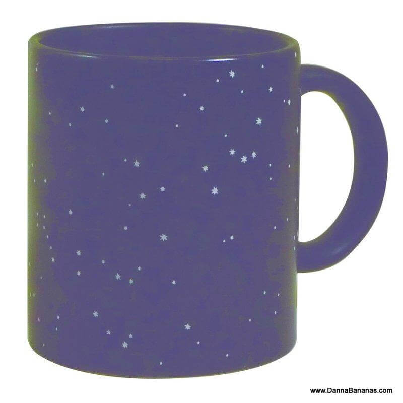 The Constellation Heat Change Mug by Danna Bananas is perfect for astronomy lovers, featuring a dark blue design with small white stars scattered across its surface. The right-side handle makes it an ideal gift for star gazers.