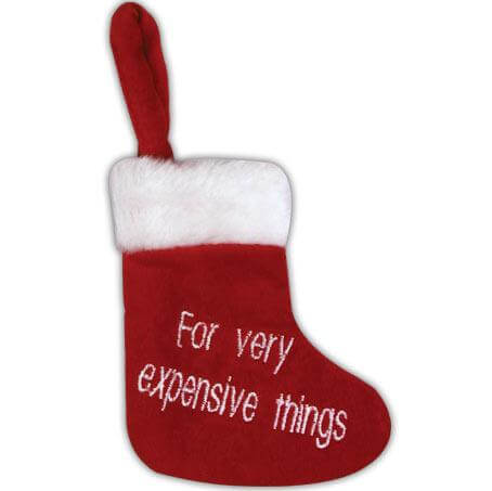 Add a touch of humor and holiday charm to your fireplace with the "Christmas Stocking for Very Expensive Things" by Danna Bananas. This red stocking features fluffy white trim, a convenient loop for hanging, and the playful phrase "For very expensive things" elegantly embroidered in white.