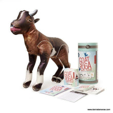 Experience the excitement of the "Goat Yoga Party Game" by Danna Bananas, which includes an inflatable goat, cards, and a score pad. Challenge yourself with different yoga poses and enjoy this one-of-a-kind entertaining game, all elegantly packaged against a clean white backdrop.