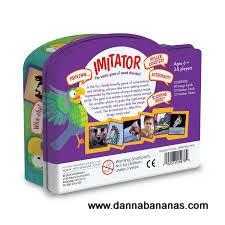 Box for the "Imitator Game" by Danna Bananas, featuring a purple and teal design with a vibrant parrot and image cards for this sound imitation game. Suitable for ages 6 and up, accommodating 3-10 players, it's a proud recipient of the PAL Award. The box includes "www.dannabananas.com".