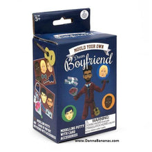 Box of the "Mould Your Own Dream Boyfriend" kit by Danna Bananas, suitable for ages 3 and up. It includes a model boyfriend figure with accessories and comes with a small parts warning. For more information, visit www.DannaBananas.com.