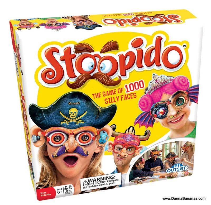 A vibrant box for the "Stoopido Game" by Danna Bananas showcases cartoonish faces with quirky accessories, making it an ideal family game or Christmas gift. Suitable for ages 6 and up.