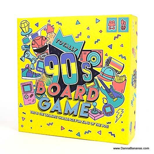 The vibrant yellow box is adorned with colorful 90s-themed illustrations, showcasing retro gadgets, patterns, and icons. The text reads "Totally 90's Board Game" by Danna Bananas, offering the ultimate nostalgic challenge packed with loads of 90s trivia for fans of the iconic decade.