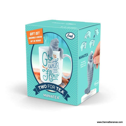 The Danna Bananas Go With The Flow Two For Tea Manatea Mug comes in a charmingly designed box with the "Go with the Flow" slogan, featuring an image of the infuser in a teacup along with product usage instructions for an enjoyable brewing experience.